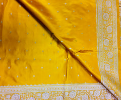 BKS117 Banarasi Mashru silk Saree in yellow. Comes with gold zari work. Comes with stitched blouse size 38 can be altered to size 42. Fall peco done.