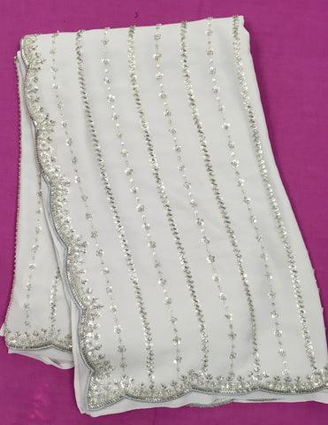 AFL3046 Partywear georgette saree in gray with silver sequin and embroidery work.Comes with stitched blouse size 40,can be altered to 44 size.Fall peco done.