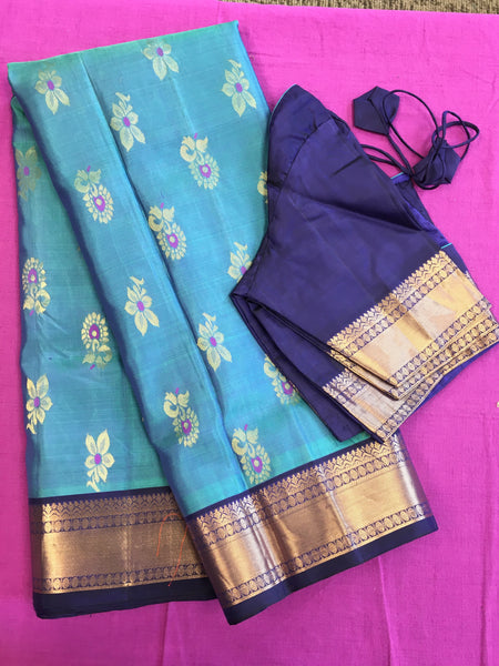 Pure kanchipuram Handloom Silk Saree in Blue with Dark Blue Zari border. Comess with Stitched Blouse size 38 can be altered up to 44
