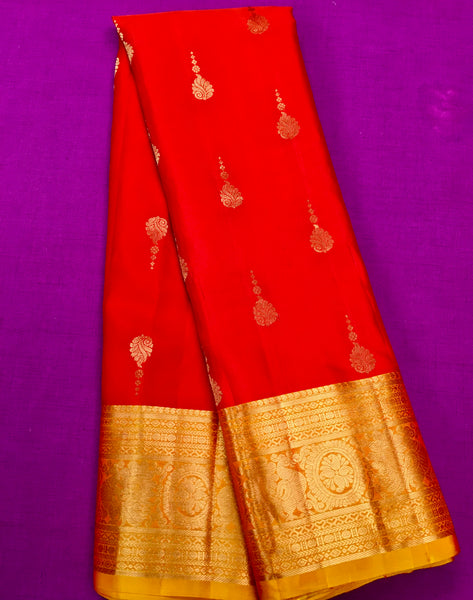 KSS410 Pure handloom kanchipuram silk Saree in Orange with yellow gold zari border.comes with stitched blouse size 40,can be altered to 44 size.