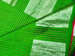 KSS402 Pure handloom kanchipuram silk Saree in green with gold and silver zari border. Comes with stitched blouse size 40,