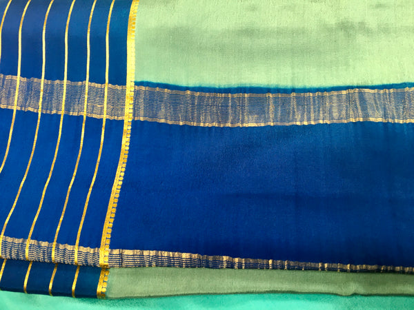 AMS1009 Pure Mysore Crepe silk Saree in blue color with dark blue gold zari border. Comes with unstitched blouse.