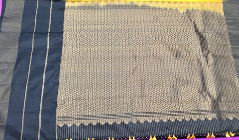 KSS406 Pure handloom kanchipuram silk Saree in yellow with black gold zari border.comes with stitched blouse size 40,can be altered to 44 size.