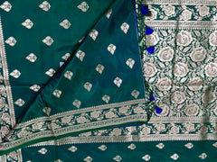 BKS120 Banarasi Mashru silk Saree in green. Comes with gold zari work. Comes with stitched blouse size 38 can be altered to size 42. Fall peco done.