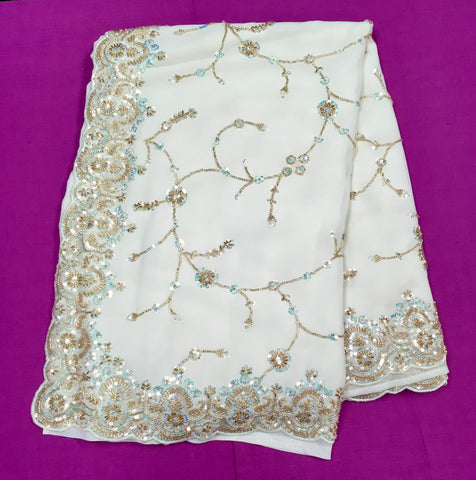 AFL3056 Partywear saree in white with  sequins and bead work.Comes with stitched blouse size 38,can be altered to 42size.Fall peco done.