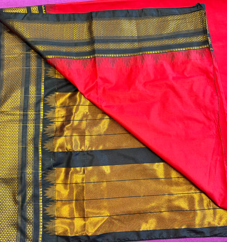Korvai silk cotton saree in red with Black  border.Fall peco done. Comes with stitched blouse size 38 can be altered up to 44 size.
