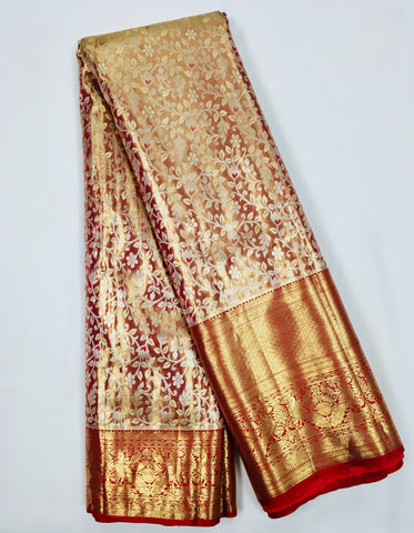 KSS513 Pure kanchipuram tissue silk Saree in gold color with orange gold zari border. comes with stitched blouse size 40,can be altered to 44 size.