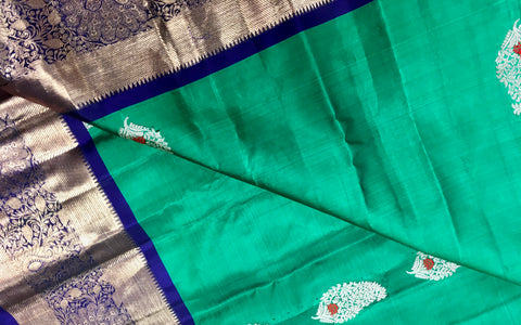 KSS404 Pure handloom kanchipuram silk Saree in greenery with blue gold zari border.comes with stitched blouse size 40,can be altered to 44 size.
