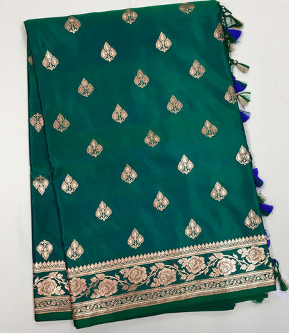 BKS120 Banarasi Mashru silk Saree in green. Comes with gold zari work. Comes with stitched blouse size 38 can be altered to size 42. Fall peco done.