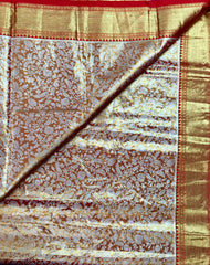 KSS448 Pure kanchipuram tissue silk Saree in orange with gold zari border.comes with stitched blouse size 40,can be altered to 44 size.