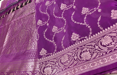 BKS130 Banarasi Mashru silk Saree in purple. Comes gold zari work. Comes with stitched blouse size 38 can be altered to size 42. Fall peco done.
