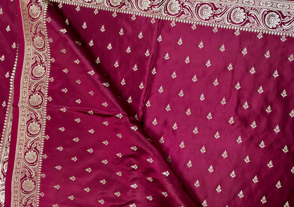 BKS126 Banarasi Mashru silk Saree in wine. Comes with gold  zari work. Comes with stitched blouse size 38 can be altered to size 42. Fall peco done.