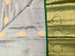 KSS420 Pure handloom kanchipuram silk Saree in gray with green gold zari border.comes with stitched blouse size 40,can be altered to 44 size.