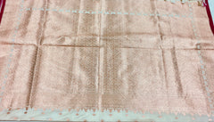 BKS131 Banarasi Mashru silk Saree in white.Comes with gold zari work. Comes with stitched blouse size 38 can be altered to size 42. Fall peco done.