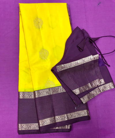 KSS413 Pure handloom kanchipuram silk Saree in yellow with brown gold zari border.comes with stitched blouse size 40,can be altered to 44 size.