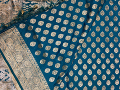 BKS124 Banarasi Mashru silk Saree in blue. Comes silver zari work. Comes with stitched blouse size 38 can be altered to size 42. Fall peco done.