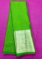 KSS402 Pure handloom kanchipuram silk Saree in green with gold and silver zari border. Comes with stitched blouse size 40,