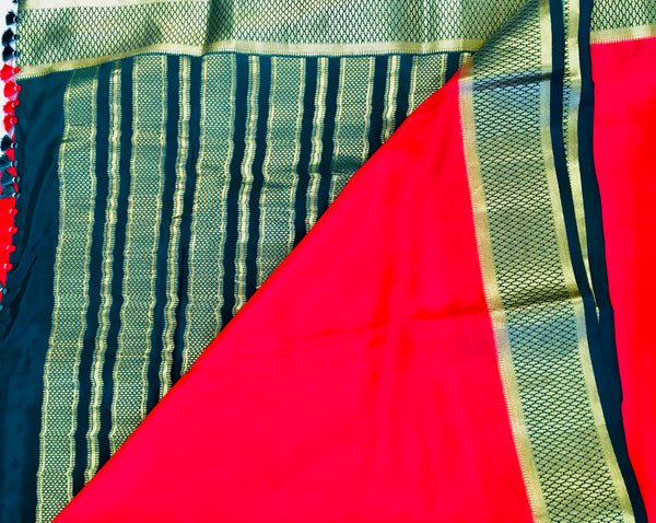 AMS1011 Pure Mysore Crepe silk Saree in red color with green gold zari border. Comes with unstitched blouse.
