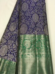 KSS507 Pure kanchipuram handloom silk Saree in purple with green color gold zari border. comes with stitched blouse size 40,can be altered to 44 size.