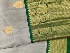 KSS420 Pure handloom kanchipuram silk Saree in gray with green gold zari border.comes with stitched blouse size 40,can be altered to 44 size.