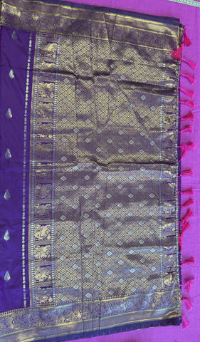 Banarasi silk  saree in purple  with Gold Zari border. Fall peco done. Comes with stitched blouse size 38 can be altered up to 44 size.