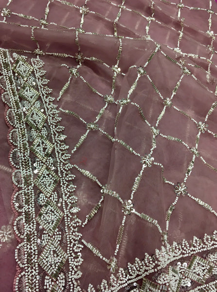 AFL3071 Partywear net saree in beige with silver bead and sequin embroidery.Comes with stitched blouse size 40,can be altered to 44 size.Fall peco done.