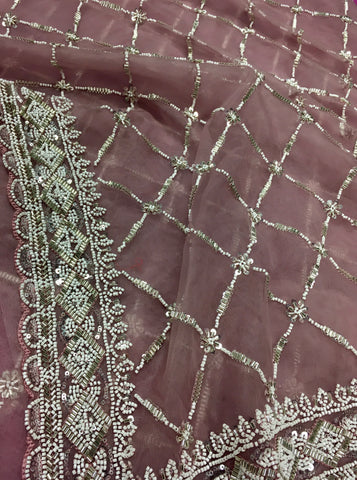 AFL3071 Partywear net saree in beige with silver bead and sequin embroidery.Comes with stitched blouse size 40,can be altered to 44 size.Fall peco done.