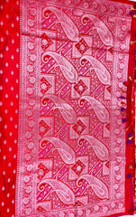 BKS116 Banarasi Mashru silk Saree in red.Comes with gold zari work. Comes with stitched blouse size 38 can be altered to size 42. Fall peco done.