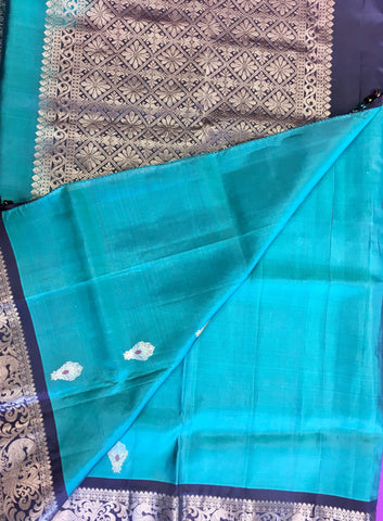Pure kanchipuram Handloom Silk Saree in Blue with Brown Zari border. Comes with Stitched Blouse size 38 can be altered up to 44