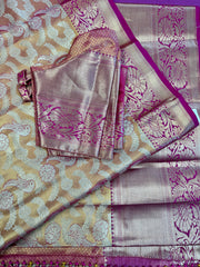 Semi silk Saree in Gold with Pink Border. Comess with stitched blouse size 38 can be altered up to 44