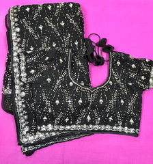AFL3063 Partywear georgette saree in black with silver sequin and bead embroidery work.Comes with stitched blouse size 40,can be altered to 44 size.Fall peco done.