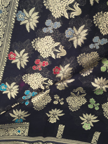 BKS106 Banarasi Georgette saree in black. Comes with stitched blouse size 38 can be altered to size 42. Fall peco done.