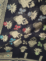 BKS106 Banarasi Georgette saree in black. Comes with stitched blouse size 38 can be altered to size 42. Fall peco done.