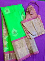 Pure kanchipuram Handloom Silk Saree in Parrot Green with Light Pink Zari border. Comess with Stitched Blouse size 38 can be altered up to 44