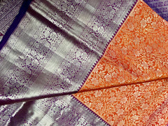 KSS415 Pure kanchipuram tissue silk Saree in orange with purple border gold zari work.comes with stitched blouse size 40,can be altered to 44 size.
