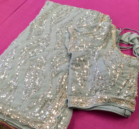 AFL3073 Party wear saree with sequin and bead work in light blue. Comes with stitched blouse size 38,can be altered to 42 size.Fall peco done.