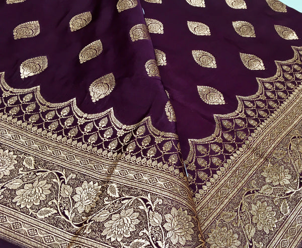 BKS127 Banarasi Mashru silk Saree in brown. Comes with gold zari work. Comes with stitched blouse size 38 can be altered to size 42. Fall peco done.