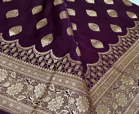 BKS127 Banarasi Mashru silk Saree in brown. Comes with gold zari work. Comes with stitched blouse size 38 can be altered to size 42. Fall peco done.