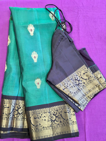 Pure kanchipuram Handloom Silk Saree in Blue with Brown Zari border. Comess with Stitched Blouse size 38 can be altered up to 44