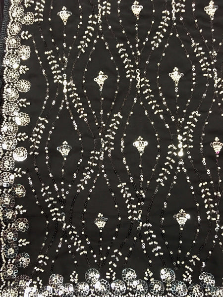 AFL3063 Partywear georgette saree in black with silver sequin and bead embroidery work.Comes with stitched blouse size 40,can be altered to 44 size.Fall peco done.