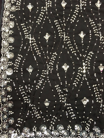 AFL3063 Partywear georgette saree in black with silver sequin and bead embroidery work.Comes with stitched blouse size 40,can be altered to 44 size.Fall peco done.