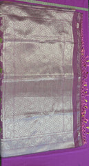 Banarasi tussar  saree in purple with gold  zari border.Fall peco done. Comess with stitched blouse size 38 can be altered up to 44 size.