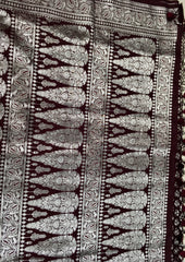 BKS125 Banarasi Mashru silk Saree in brown. Comes with silver zari work. Comes with stitched blouse size 38 can be altered to size 42. Fall peco done.