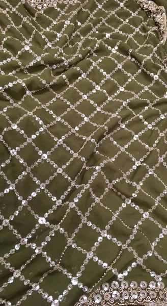 AFL3069 Partywear saree in green georgette fabric with silver sequins embroidery work.Comes with stitched blouse size 40,can be altered to 44 size.Fall peco done.