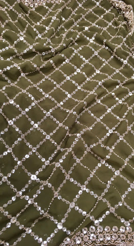 AFL3069 Partywear saree in green georgette fabric with silver sequins embroidery work.Comes with stitched blouse size 40,can be altered to 44 size.Fall peco done.