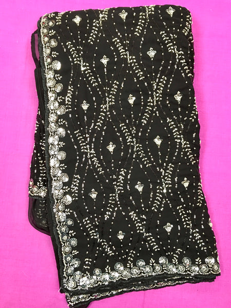 AFL3063 Partywear georgette saree in black with silver sequin and bead embroidery work.Comes with stitched blouse size 40,can be altered to 44 size.Fall peco done.
