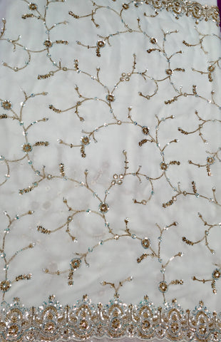 AFL3056 Partywear saree in white with  sequins and bead work.Comes with stitched blouse size 38,can be altered to 42size.Fall peco done.