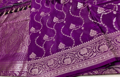 BKS130 Banarasi Mashru silk Saree in purple. Comes gold zari work. Comes with stitched blouse size 38 can be altered to size 42. Fall peco done.