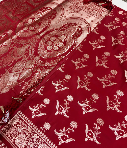 BKS121 Banarasi Mashru silk Saree in maroon. comes with gold zari work. Comes with stitched blouse size 38 can be altered to size 42. Fall peco done.