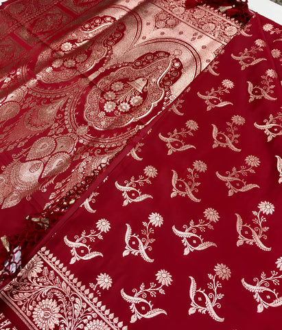 BKS121 Banarasi Mashru silk Saree in maroon. comes with gold zari work. Comes with stitched blouse size 38 can be altered to size 42. Fall peco done.